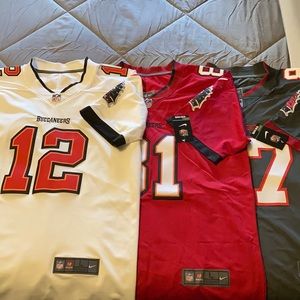 Three (3) Tampa Bay Buccaneers fan jerseys.